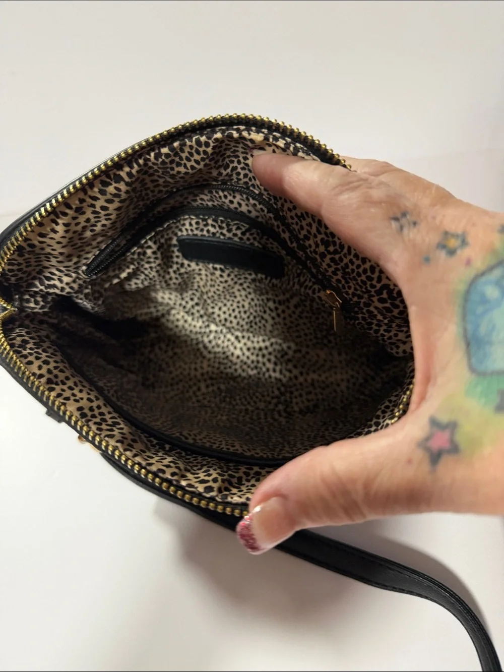 Black Crossbody Bag with Gold Medallion